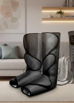Black foot massager with control panel on a teal background