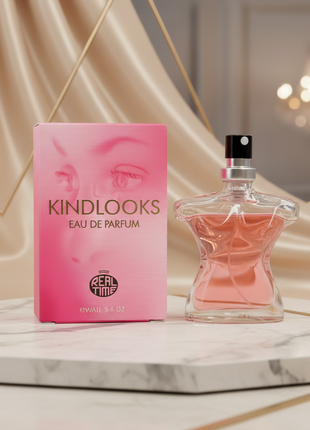 Pink perfume bottle and packaging with 'KindLooks' branding on a white background