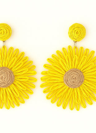 Yellow flower-shaped earrings on a white background