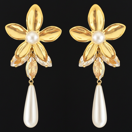 Gold flower-shaped earrings with pearl drops on a black background