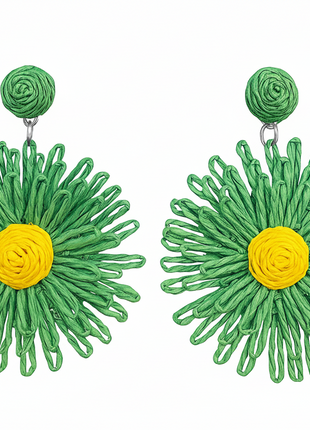 Green floral earrings with yellow centers on a white background