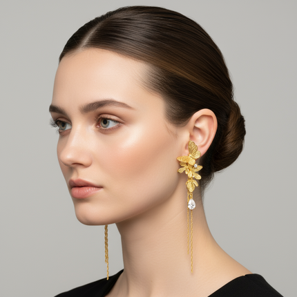 Gold butterfly hairpins with clear gemstones on a white background