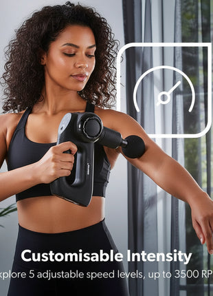 Woman using a handheld massage device on her arm with text about customizable intensity.