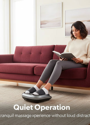 Woman using a foot massager in a living room with text 'Quiet Operation'.