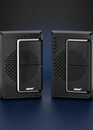 Pair of black speakers on a white background