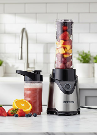 Geepas portable blender with a container of juice and fruits on a white background