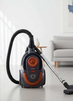 Vacuum cleaner on a wooden floor with a brown couch and wooden panel wall in the background