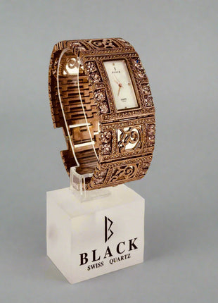 Decorative watch on a stand with 'Black Swiss Quartz' branding