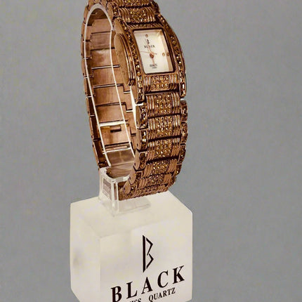 Wooden watch on a beige background with 'BLACK' branding.