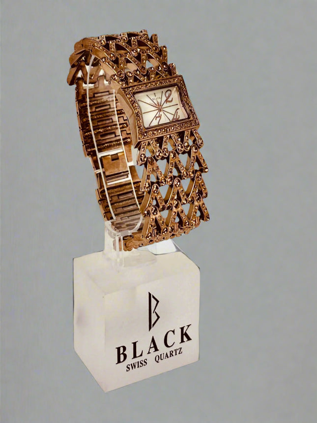 Decorative watch on a stand with 'Black Swiss Quartz' branding against a gray background