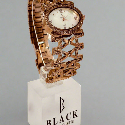Decorative watch on a stand with 'Black Swiss Quartz' branding