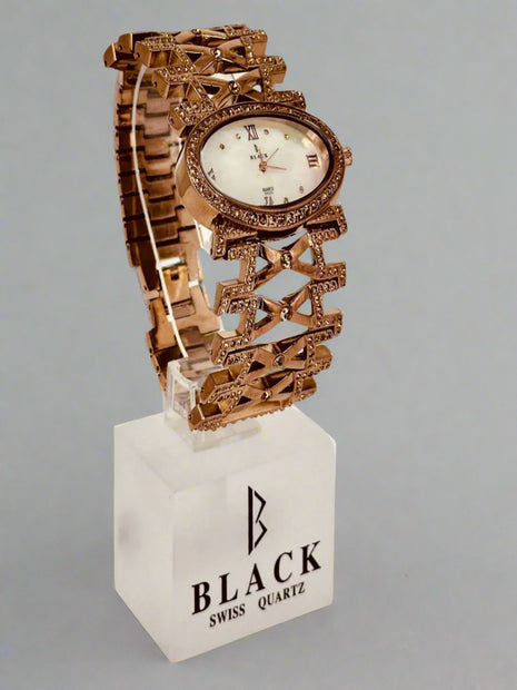 Decorative watch on a stand with 'Black Swiss Quartz' branding