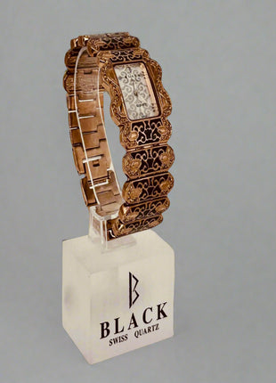 Decorative watch on a stand with 'Black Swiss Quartz' branding