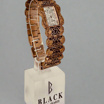 Decorative watch on a stand with 'Black Swiss Quartz' branding