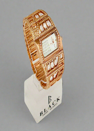 Rose gold watch on a display stand with 'Black' branding