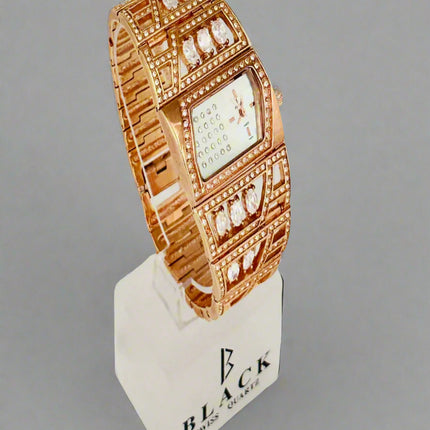 Rose gold watch on a display stand with 'Black' branding