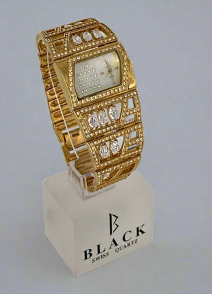 Gold wristwatch with diamond accents on a stand featuring 'Black Swiss Quartz' branding.
