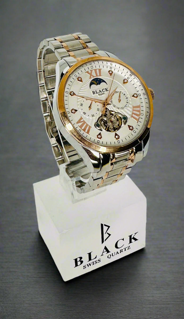 Silver and rose gold watch on a white stand with 'Black' branding