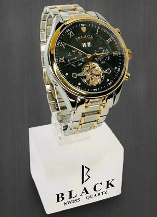 Luxury watch with black face and gold accents on a white background