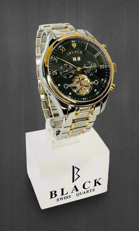 Luxury watch with black face and gold accents on a white background