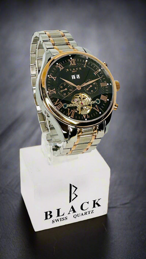Two-tone watch on a stand with 'Black Swiss Quartz' branding