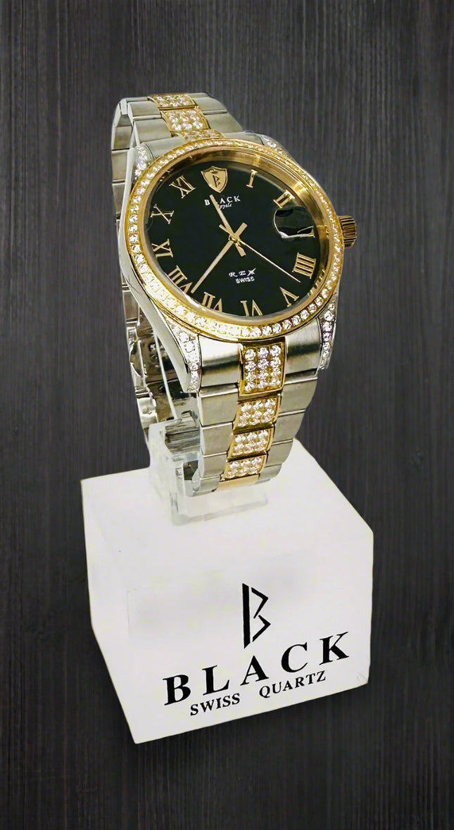 Silver and gold watch with black face on a white stand, featuring the brand 'Black Swiss Quartz'.