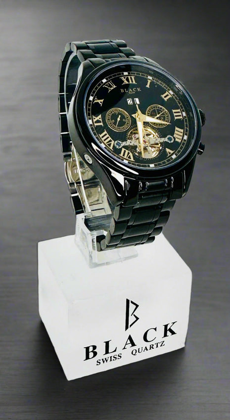 Black Swiss Quartz watch on a white stand with a white background