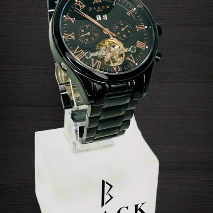 Black Swiss Quartz watch on a white stand with a white background