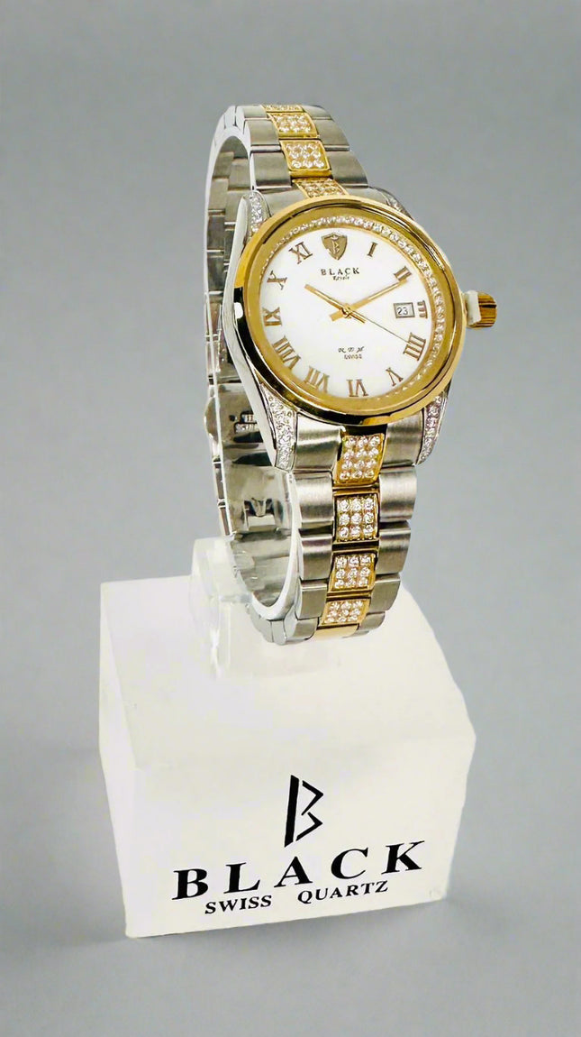 Two-tone watch with gold and silver band on a white background