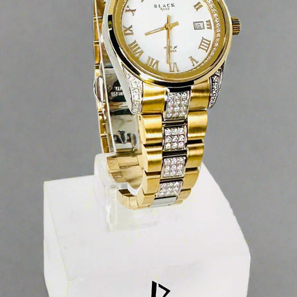 Gold and silver watch on a white background with 'Black Swiss Quartz' branding.