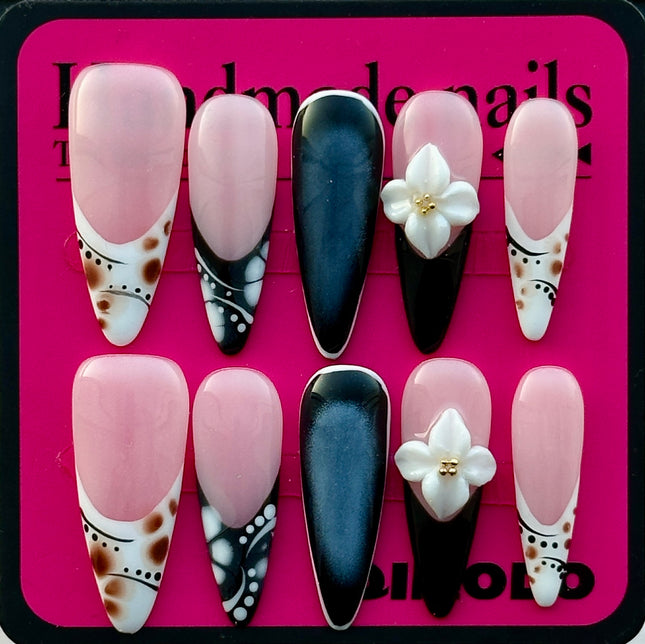 Chic Black & White Almond Press-On Nails with 3D Floral Details – A French-Inspired Reusable Set for Effortless Daily Style and Special Moments.