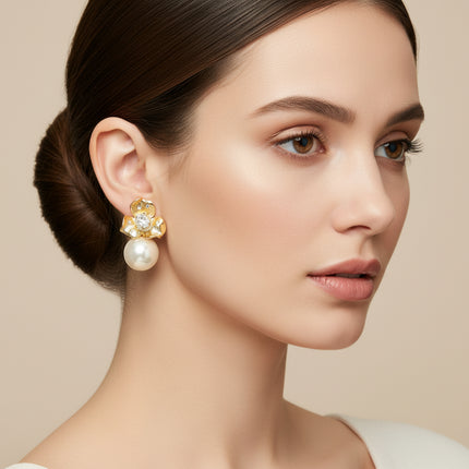 Close-up of a woman wearing a pearl earring with a beige background