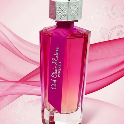 Pink perfume bottle with silver cap on a white background