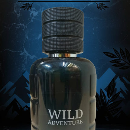 Bottle of 'Wild Adventure' Absolu with mountain and leaf design on a dark background